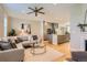 Open-concept living space flows into a modern kitchen, with comfortable seating and a stylish aesthetic at 3411 N Xenia St, Denver, CO 80238