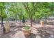 Picturesque park featuring picnic tables, shade trees, and decorative stone elements at 3411 N Xenia St, Denver, CO 80238