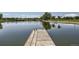 Scenic pond featuring a small dock and wildlife at 3411 N Xenia St, Denver, CO 80238