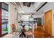 Contemporary dining area showcasing a glass table and seamless connection with a modern kitchen at 1020 15Th St # 214, Denver, CO 80202