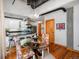 Dining area features a modern chandelier and connects to an open kitchen with an eat-in breakfast bar at 1020 15Th St # 214, Denver, CO 80202