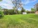 Large backyard with mature trees and greenery at 2797 S Newton Way, Denver, CO 80236