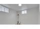 Finished basement features neutral colors and two windows for natural light at 2797 S Newton Way, Denver, CO 80236