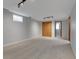 Finished basement with neutral carpeting, a closet, and overhead lighting at 2797 S Newton Way, Denver, CO 80236