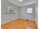 Bedroom featuring hardwood floors, neutral walls, and windows with blinds at 2797 S Newton Way, Denver, CO 80236