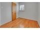 Bedroom featuring hardwood floors, neutral walls and a closet at 2797 S Newton Way, Denver, CO 80236