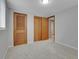 Empty bedroom with a closet and neutral carpet, with natural light at 2797 S Newton Way, Denver, CO 80236
