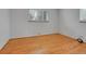 Bedroom featuring hardwood floors, neutral walls, and window with blind at 2797 S Newton Way, Denver, CO 80236