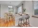 Cozy dining area with a view of the outside and a stylish light fixture at 2797 S Newton Way, Denver, CO 80236