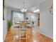Well-lit dining room features hardwood floors and a view of the kitchen at 2797 S Newton Way, Denver, CO 80236