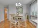 Bright dining area with hardwood floors, art piece, and natural light at 2797 S Newton Way, Denver, CO 80236