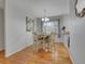 Charming dining room with chandelier, hardwood floors, and ample natural light at 2797 S Newton Way, Denver, CO 80236