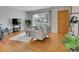 Cozy living room featuring hardwood floors, natural light, and a comfortable seating area at 2797 S Newton Way, Denver, CO 80236