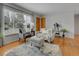 Inviting living room with large window, hardwood floors, and neutral decor at 2797 S Newton Way, Denver, CO 80236