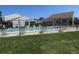 Gated community pool surrounded by manicured green space at 8781 N Pierce Way # 102, Arvada, CO 80003