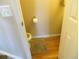 Small powder room with a new toilet and wood floors at 8781 N Pierce Way # 102, Arvada, CO 80003