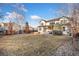 Expansive backyard featuring a pergola-covered patio and built-in fire pit, perfect for outdoor entertaining at 2342 Hickory Pl, Erie, CO 80516