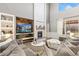 Inviting living room with a fireplace feature wall, large windows, and a cozy seating area at 2342 Hickory Pl, Erie, CO 80516