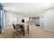 Open loft area with a desk, chair, neutral carpeting, and white railings overlooking the main floor at 2342 Hickory Pl, Erie, CO 80516