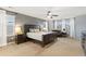 Spacious main bedroom featuring a ceiling fan, a sitting area, and large windows offering natural light at 2342 Hickory Pl, Erie, CO 80516