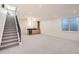 Spacious basement featuring a modern staircase, wet bar, and plenty of natural light at 374 S Humboldt St, Denver, CO 80209