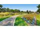 Beautiful garden landscape featuring a winding path, lush greenery, and colorful flowers on a sunny day at 374 S Humboldt St, Denver, CO 80209