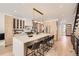 Bright kitchen features a waterfall island with bar seating, modern cabinets, and stainless steel appliances at 374 S Humboldt St, Denver, CO 80209