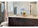 Bathroom with dual sinks, dark wood cabinets, and a separate shower, perfect for a modern home at 3887 Grand Baker St, Aurora, CO 80019