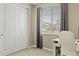 Bedroom featuring a large window, gray curtains, and a closet at 3887 Grand Baker St, Aurora, CO 80019