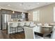 Modern kitchen with stainless steel appliances, quartz countertops, and an island with seating at 3887 Grand Baker St, Aurora, CO 80019