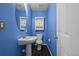 Bathroom featuring a modern sink, toilet, and cabinet at 19524 Montview Dr, Aurora, CO 80011