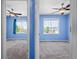 Bedrooms with blue walls, carpet, and ceiling fans at 19524 Montview Dr, Aurora, CO 80011