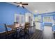 Open dining area with stylish table and a view to a well equipped kitchen at 19524 Montview Dr, Aurora, CO 80011