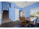 Dining room view including table, chairs, stairs, and entryway at 19524 Montview Dr, Aurora, CO 80011