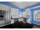Well-lit kitchen with stainless steel appliances, tile backsplash, and a granite countertop at 19524 Montview Dr, Aurora, CO 80011