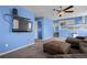 Comfortable living space with stairs, mounted television, and open layout at 19524 Montview Dr, Aurora, CO 80011