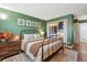 Bedroom featuring an ample closet with storage and decoratively painted walls at 2835 S Monaco Pkwy # 1-103, Denver, CO 80222