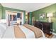 Stylish bedroom with an open closet filled with clothing and storage at 2835 S Monaco Pkwy # 1-103, Denver, CO 80222