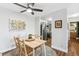 The dining area flows seamlessly to the kitchen with stainless steel appliances and cozy bathroom at 2835 S Monaco Pkwy # 1-103, Denver, CO 80222