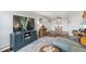 Inviting living room with TV, modern decor, dining area, and well-placed lighting for a cozy atmosphere at 2835 S Monaco Pkwy # 1-103, Denver, CO 80222