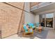 Outdoor patio area with comfortable seating and a view of the sliding door at 2835 S Monaco Pkwy # 1-103, Denver, CO 80222