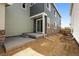 Backyard features a covered patio with stone accents, perfect for entertaining guests at 20871 E 60Th Ave, Aurora, CO 80019