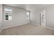 Neutral bedroom with carpet, white walls, and two windows at 20871 E 60Th Ave, Aurora, CO 80019