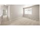 Bright and airy bedroom with a large window, neutral walls, and carpet flooring at 20871 E 60Th Ave, Aurora, CO 80019