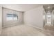 Spacious bedroom featuring carpet flooring, neutral walls, and a window with neighborhood views at 20871 E 60Th Ave, Aurora, CO 80019