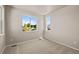Neutral toned bedroom with a light-filled window that gives a view at 20871 E 60Th Ave, Aurora, CO 80019