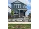Charming two-story home with stone accents and well-manicured front yard at 20871 E 60Th Ave, Aurora, CO 80019