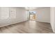 Bright living room featuring wood flooring, a large window, and a sliding door, creating a welcoming atmosphere at 20871 E 60Th Ave, Aurora, CO 80019