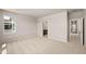 Spacious main bedroom with carpet, neutral walls, a window and bathroom at 20871 E 60Th Ave, Aurora, CO 80019