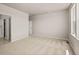 Large main bedroom with carpet, neutral walls, window and bathroom access at 20871 E 60Th Ave, Aurora, CO 80019